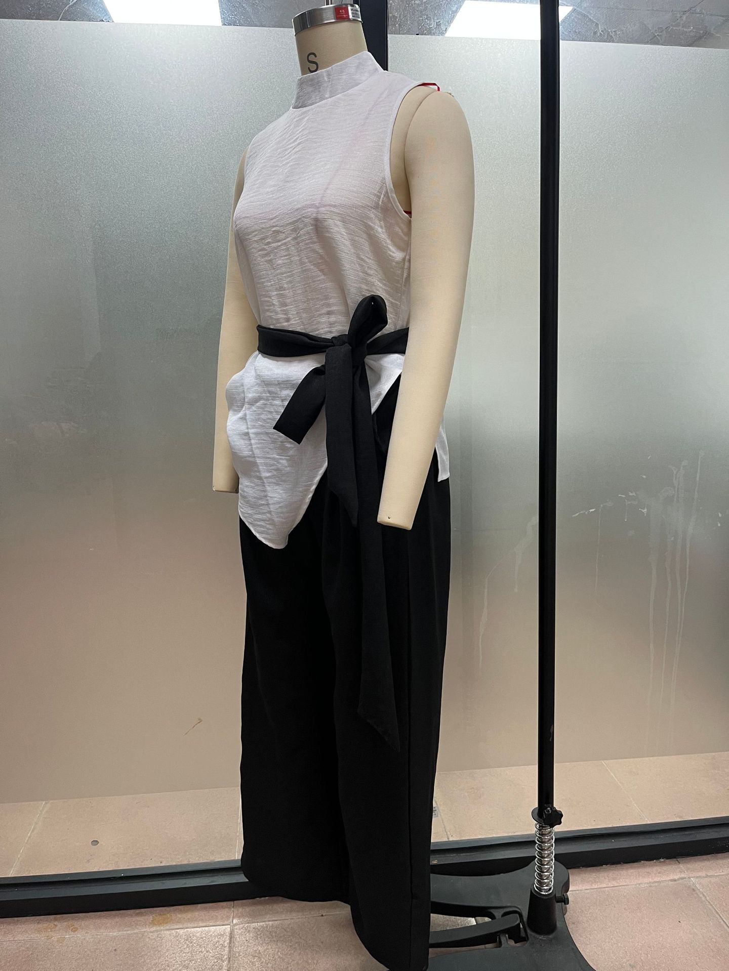 Women's lace-up sleeveless top and wide-leg pants two-piece set in white – full outfit front view