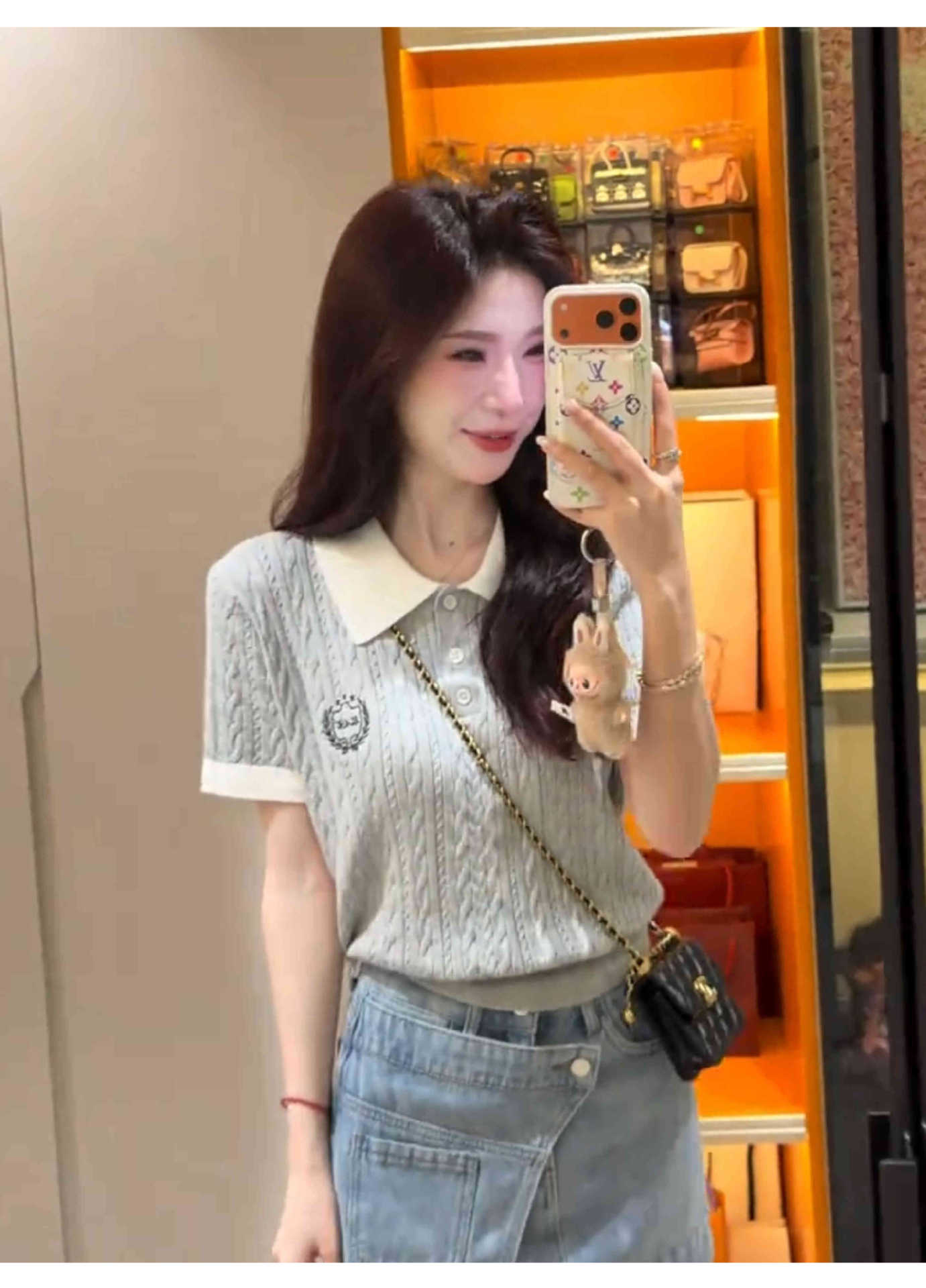Model wearing the knit top showing fit and length