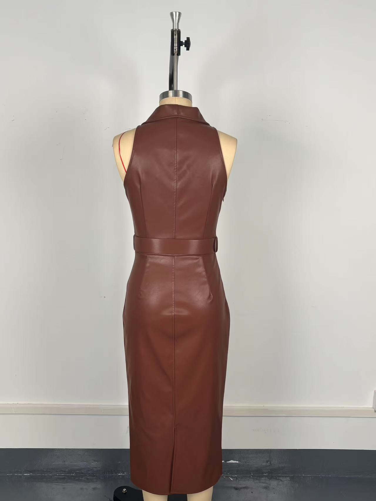 Sleeveless faux leather dress in caramel - close-up waist belt and collar detail