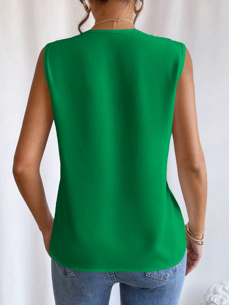 Women's apricot layered V-neck top styled with trousers