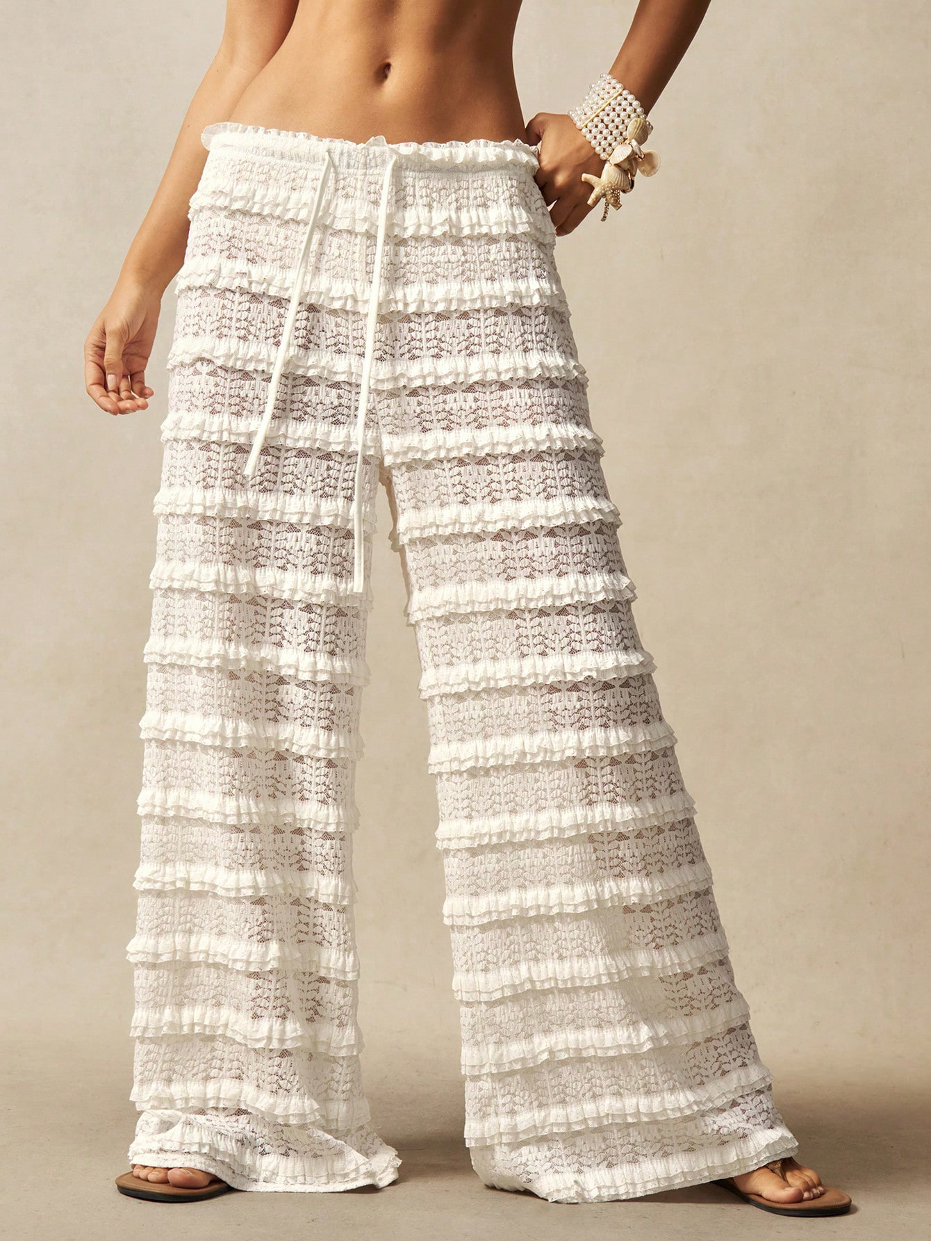 Women's lace jacquard pants lifestyle shot – beach resort summer styling