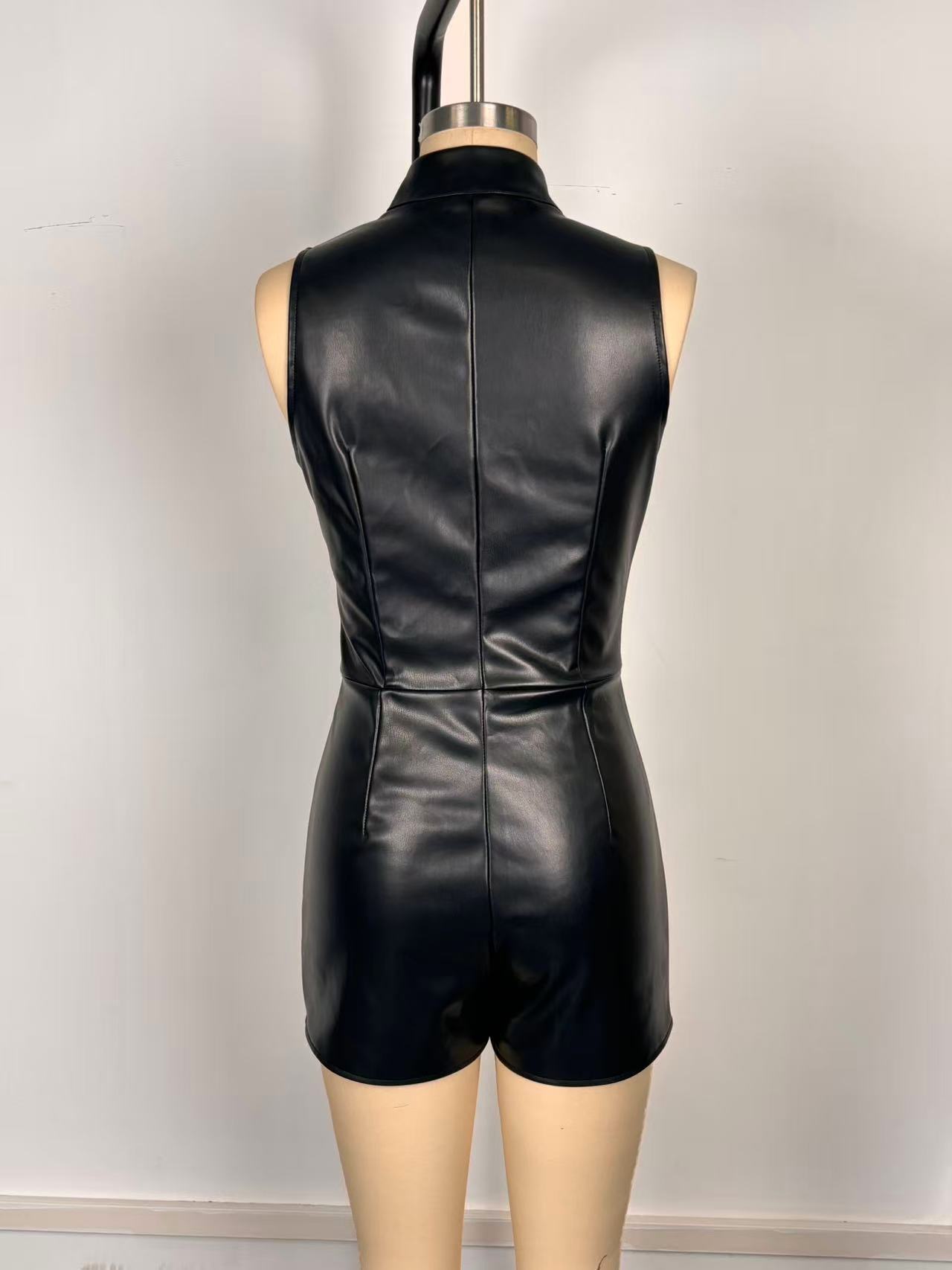 Sexy sleeveless PU leather jumpsuit in black - model wearing full outfit