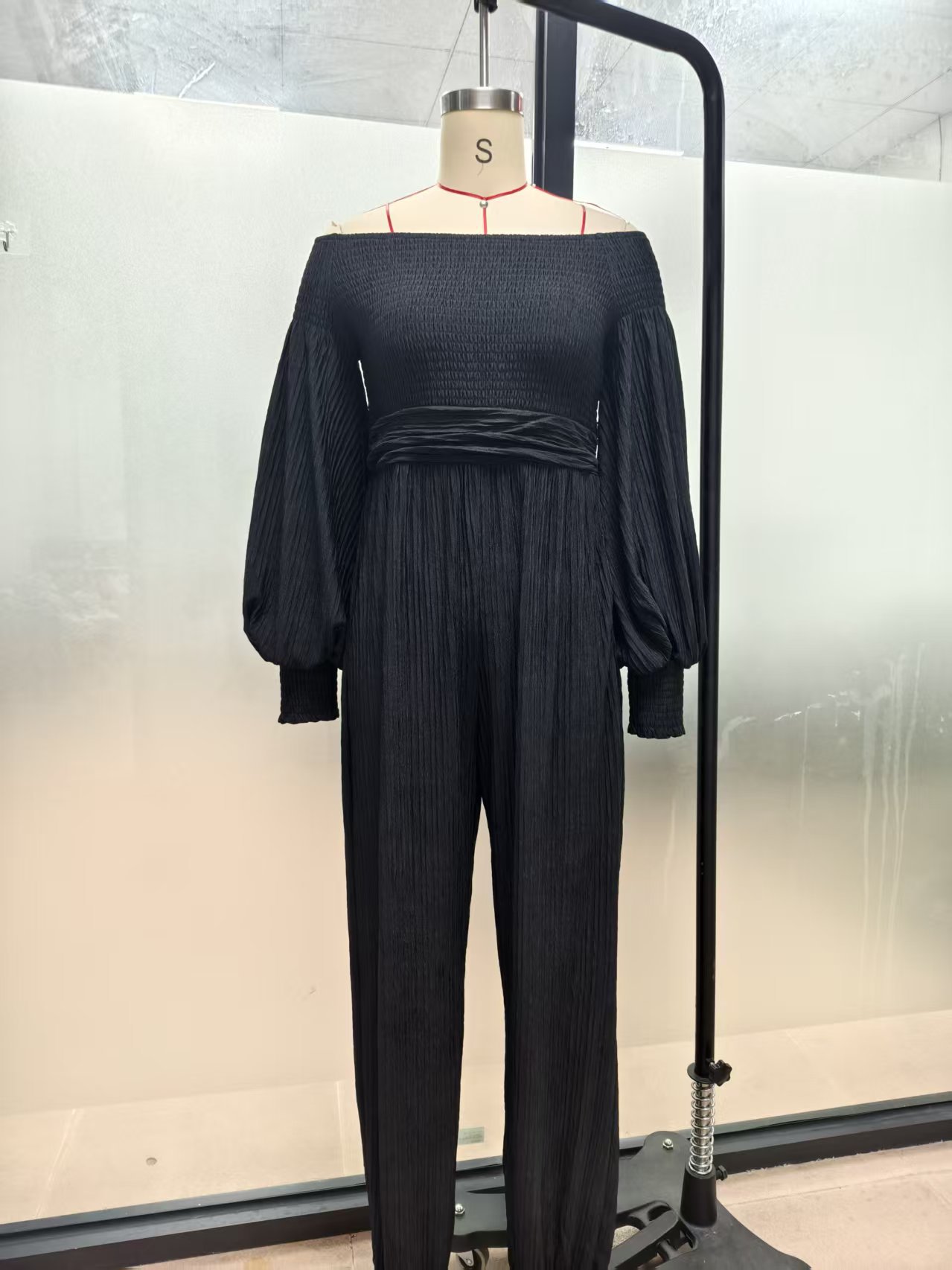 Women's off-shoulder lantern sleeve pleated loose jumpsuit — front view lifestyle shot