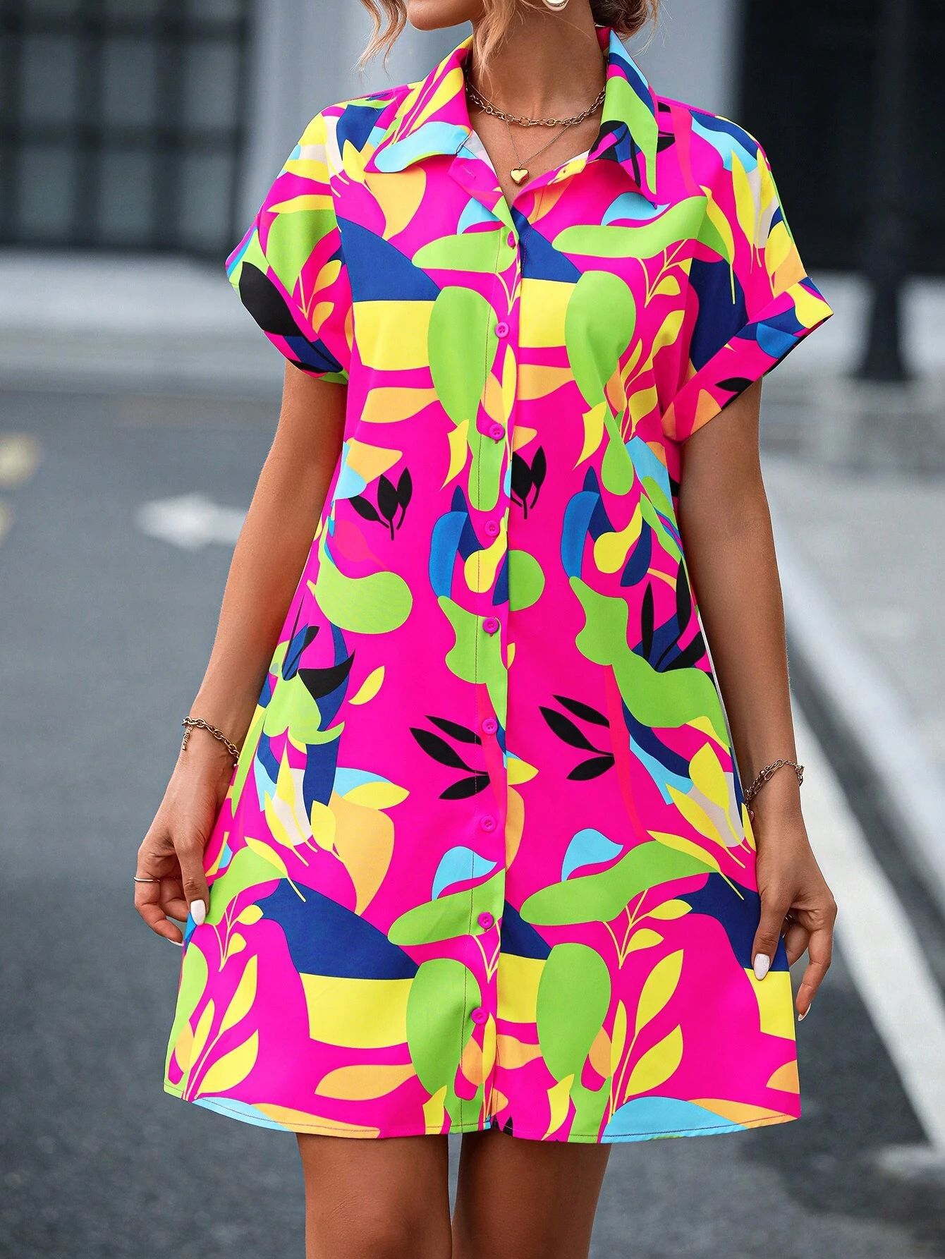 Women's tropical print dress collar and button placket close-up