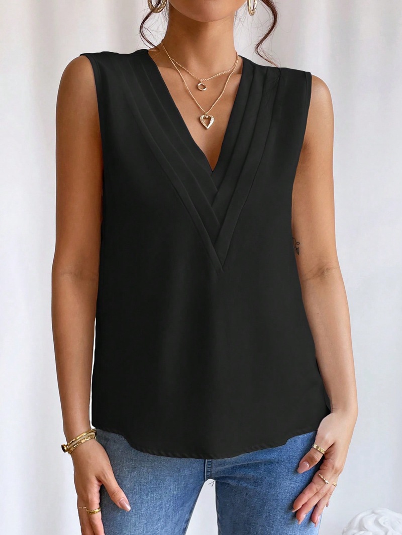 Women's apricot layered V-neck top detail close-up