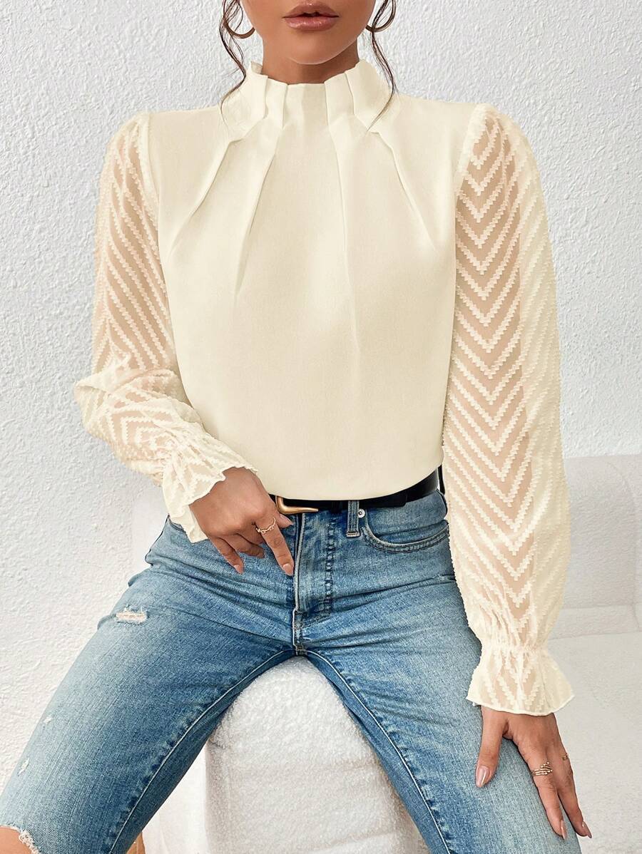 Women's off-white chiffon blouse lifestyle shot – styled with jeans