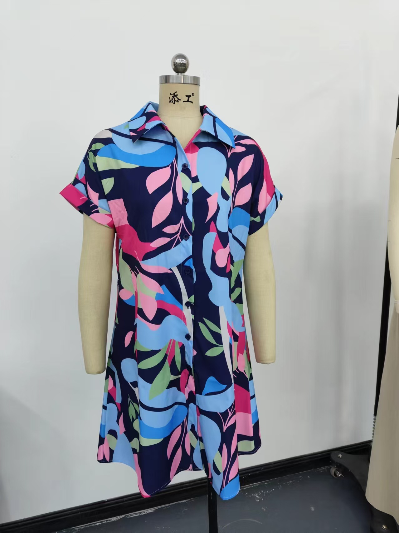 Women's tropical print shirt dress product detail view – button front collar