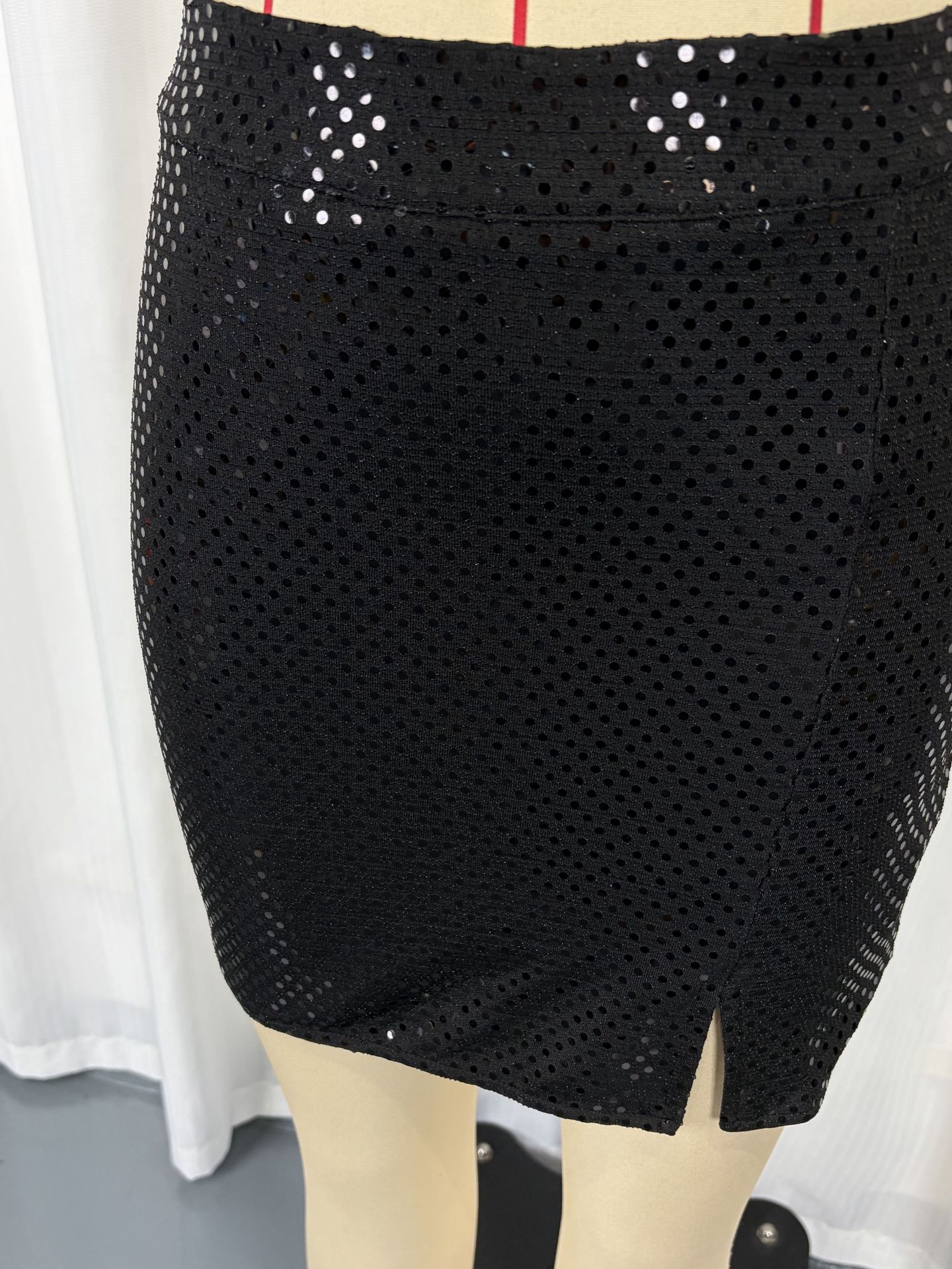Women's black sequin two-piece – vest and mini shorts party outfit detail