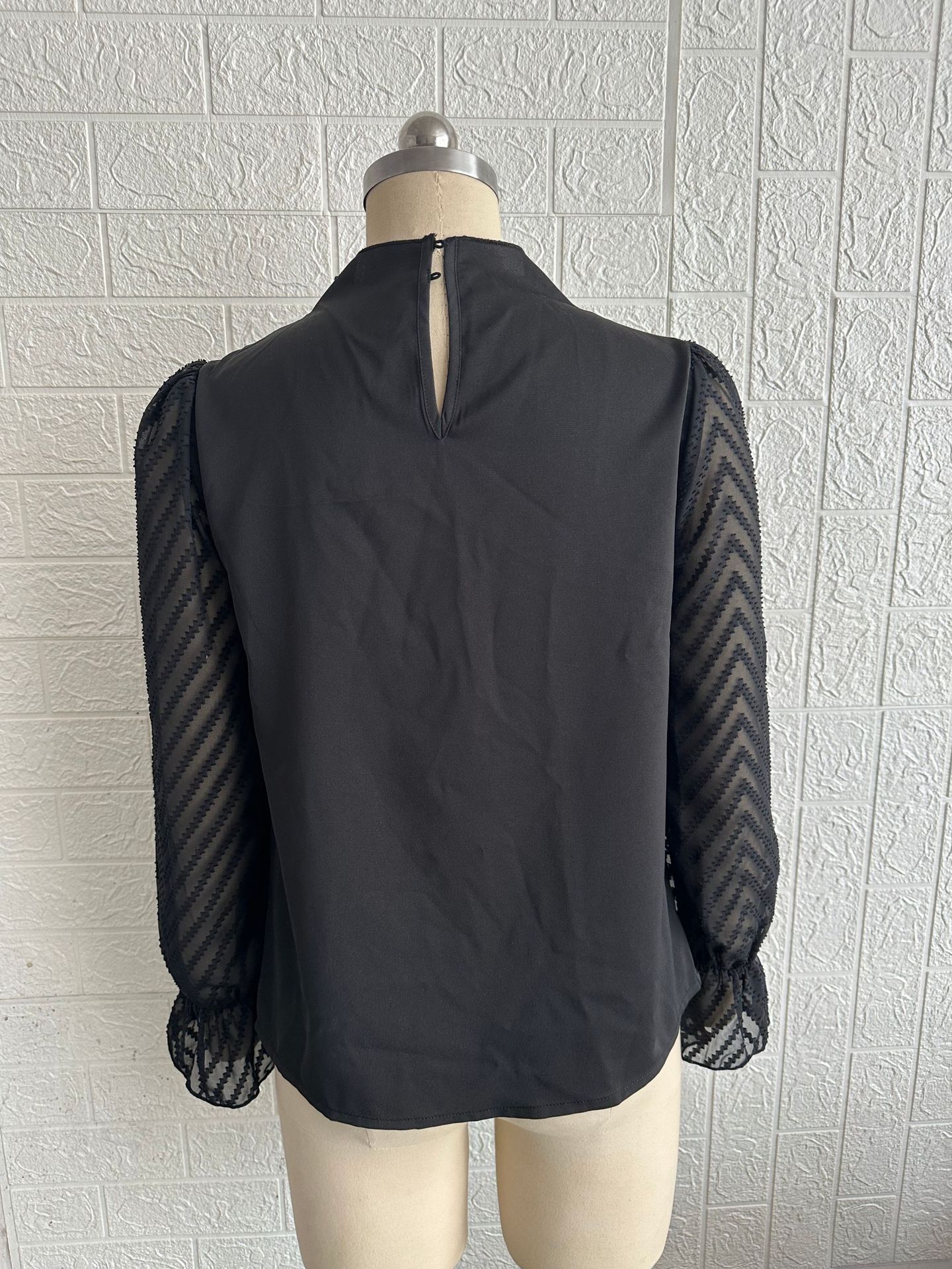 Chiffon blouse wave pattern sheer sleeve close-up detail