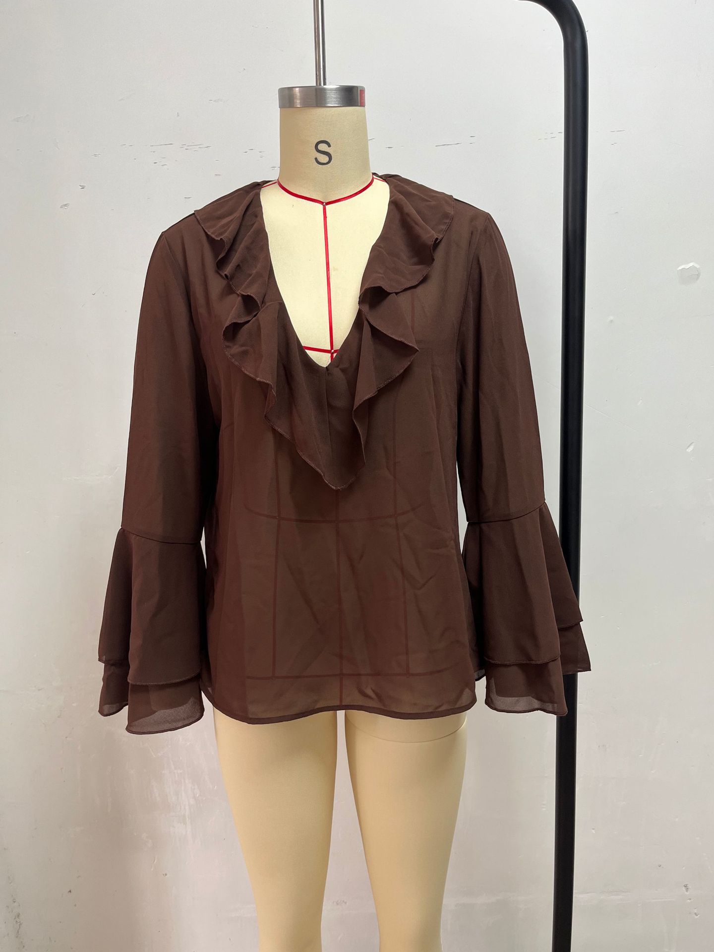 Women's V-neck ruffle long sleeve blouse — front view lifestyle shot
