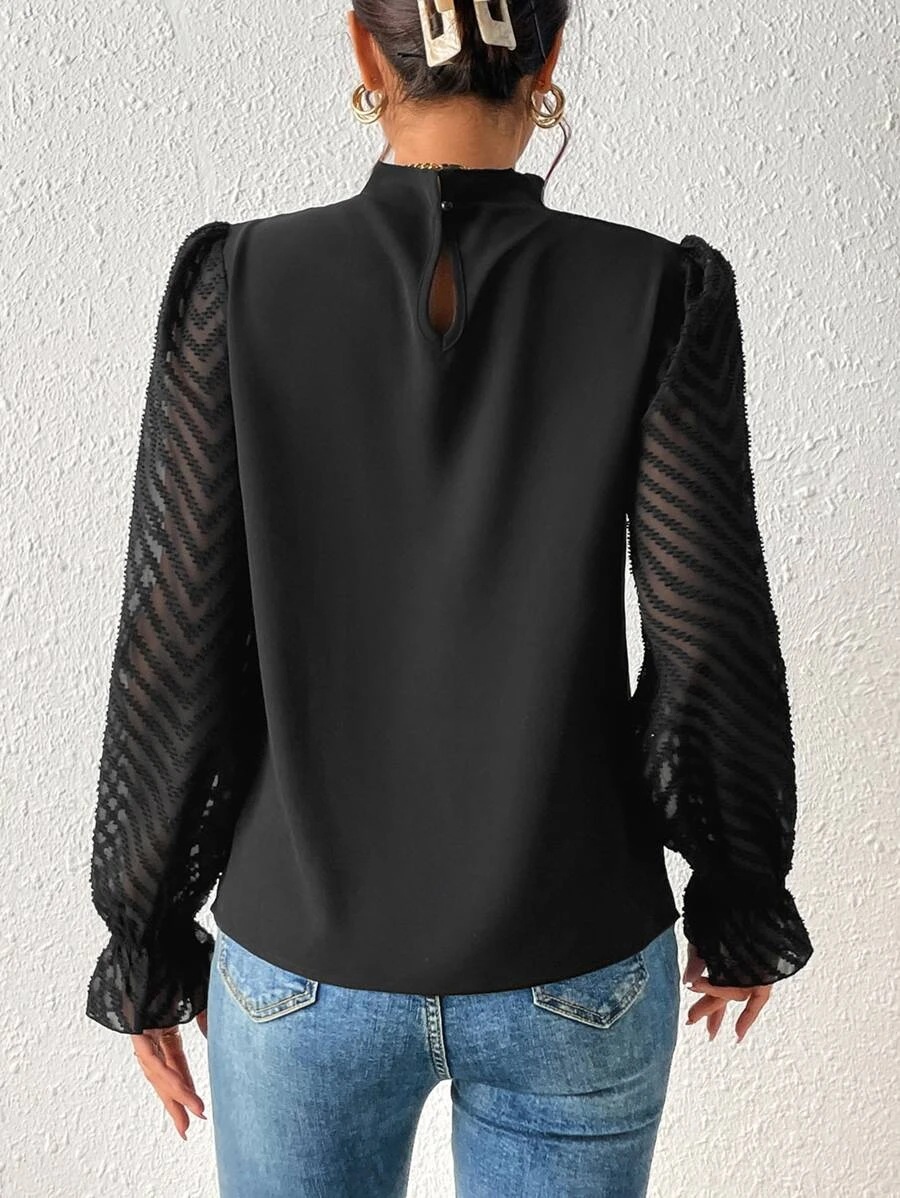 Women's chiffon top fabric and drape detail close-up