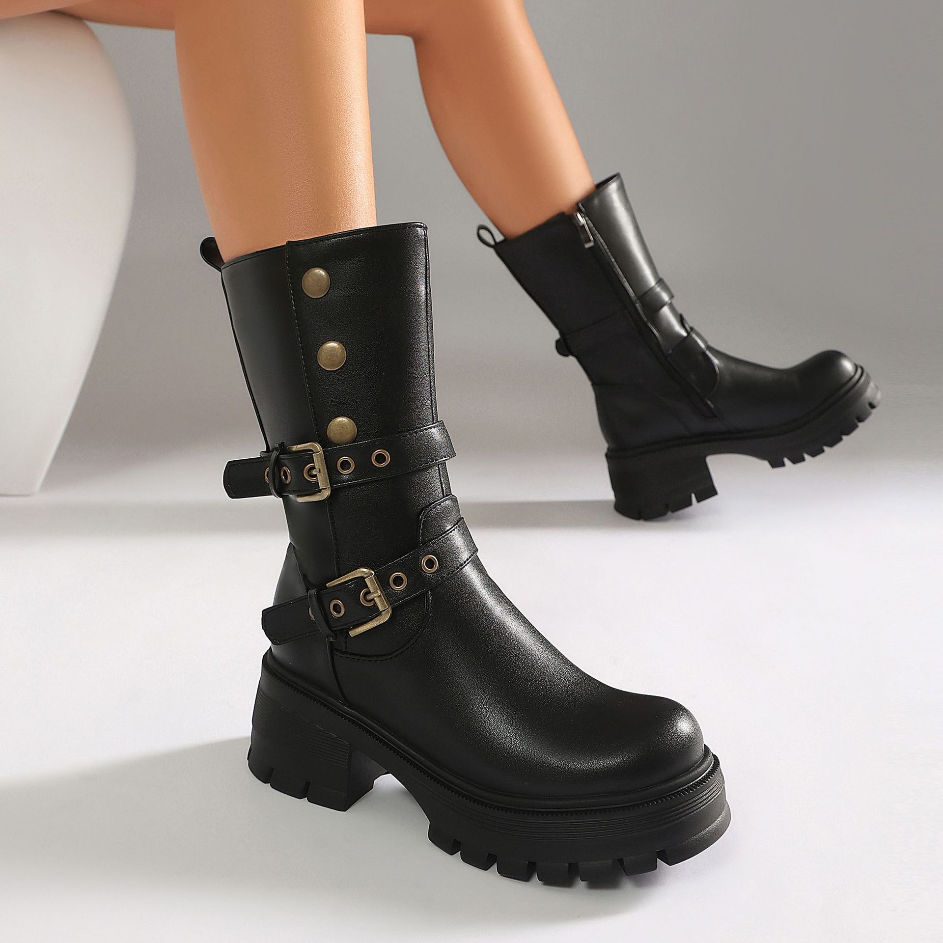 Black PU punk boots – close-up of glossy PU finish and dual gold buckle strap detail