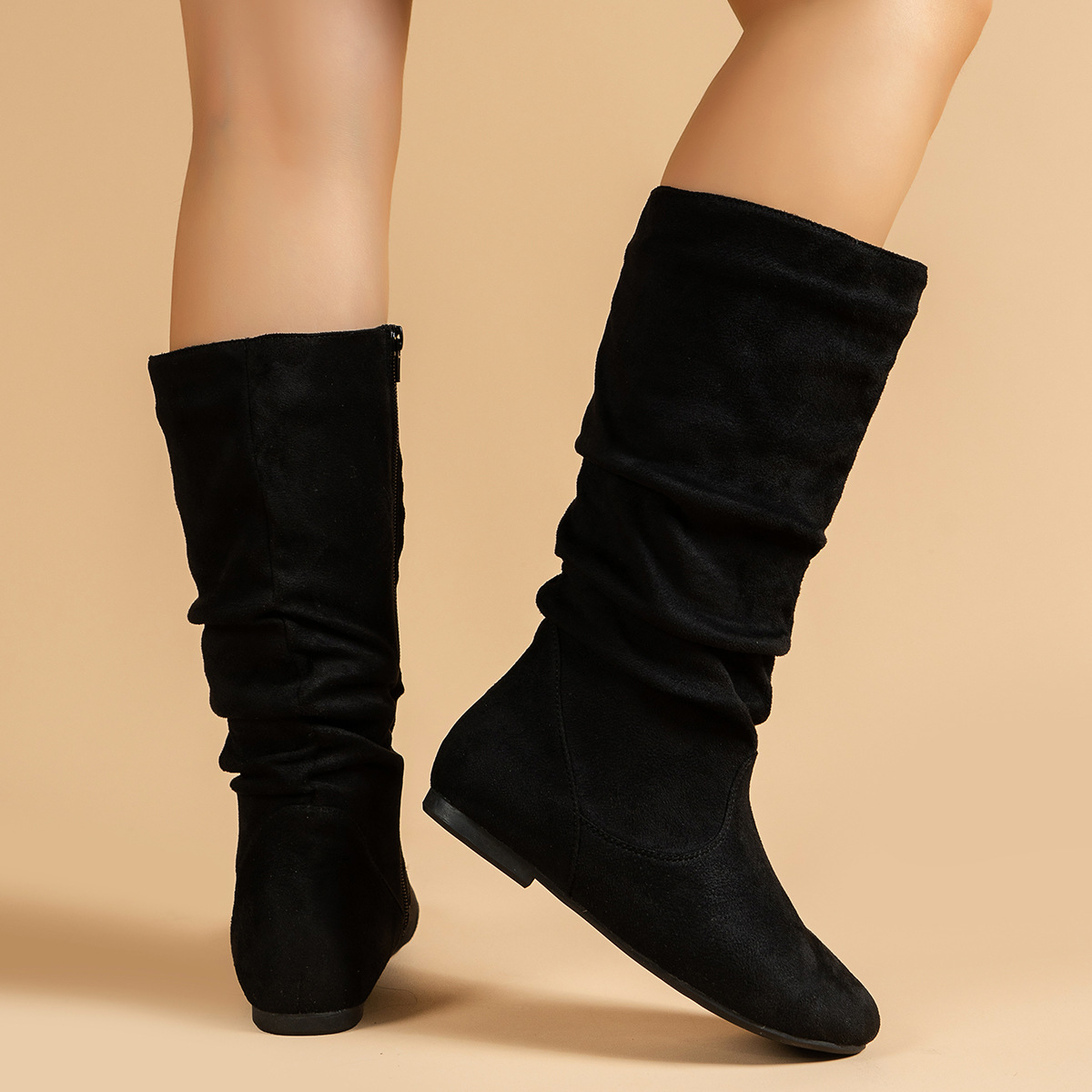 Women's mid-calf boots detail view – suede texture and side zip