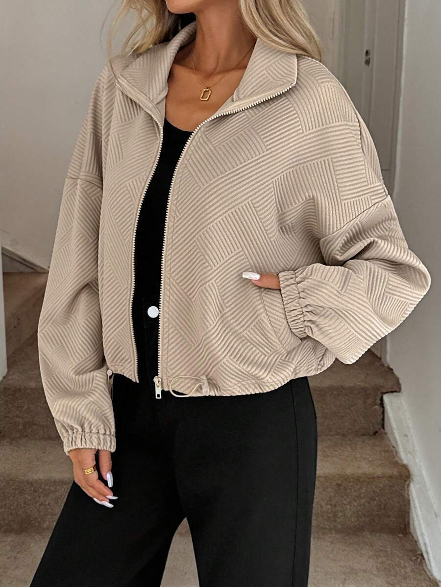 Caramel zip-up jacket – front view on model showing stand collar and full-length zipper