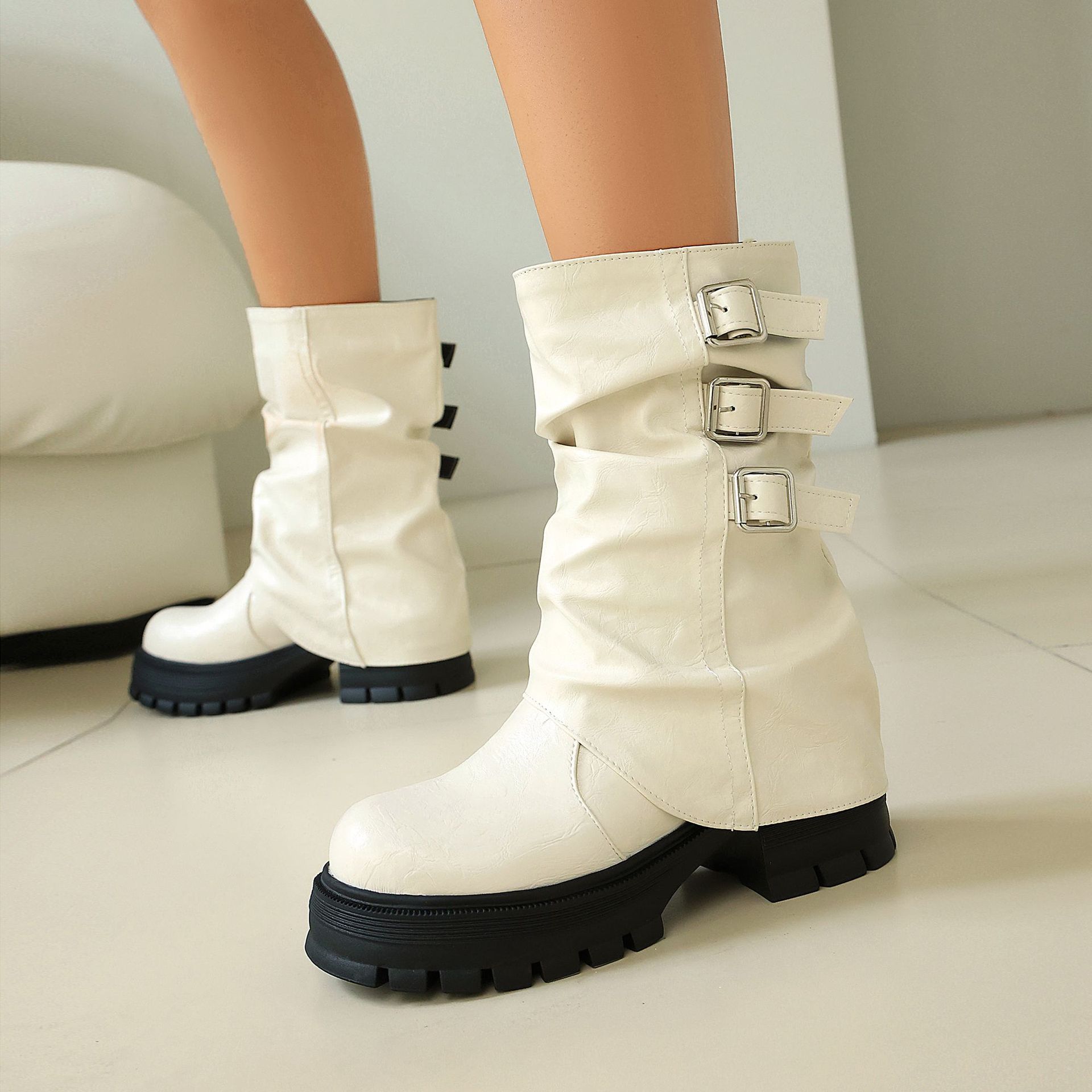 Women's punk mid-calf boots – back view showing slip-on design and lug sole detail