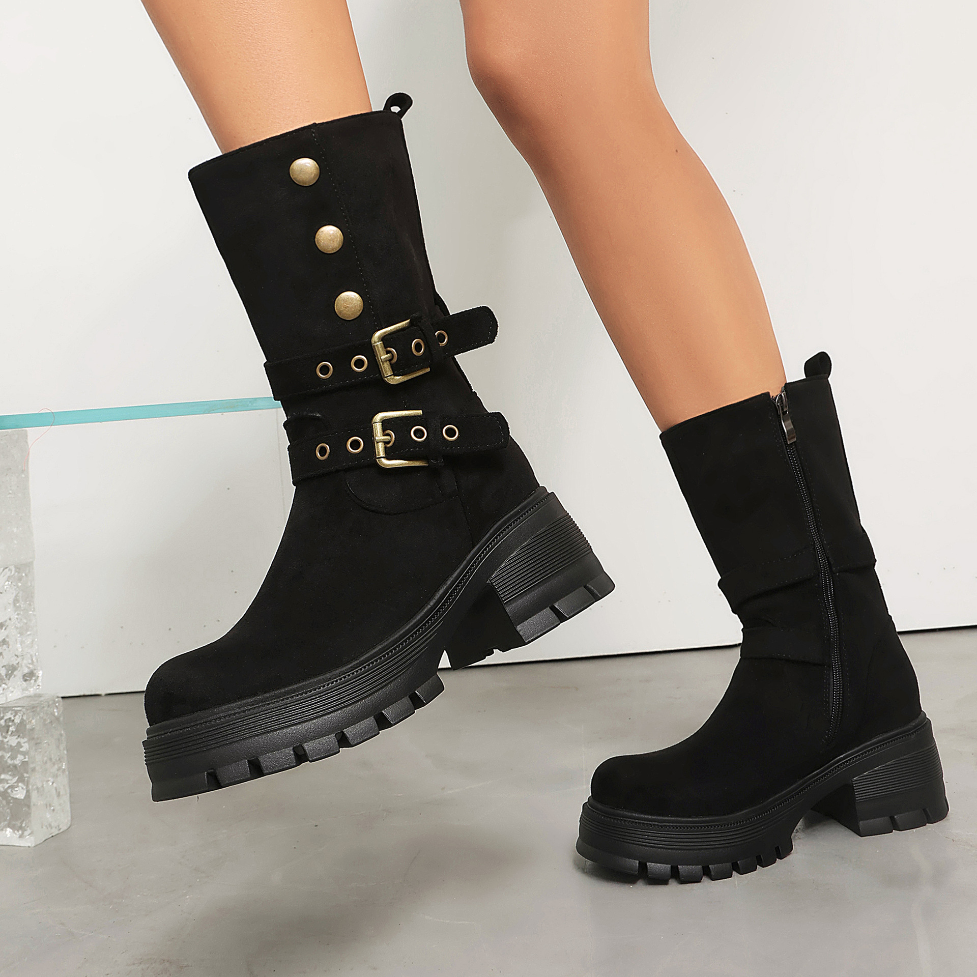 Women's studded moto boots – close-up of stud rivets and dual buckle strap detail on shaft