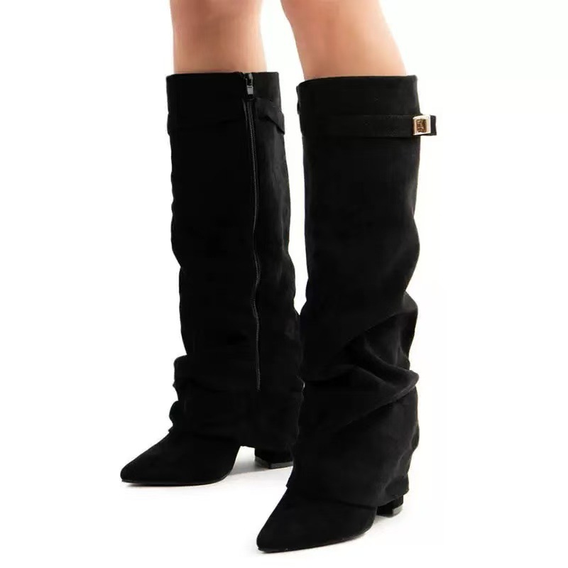 Slouchy pleated mid-calf boots – editorial shot showing elegant drape and pointed toe silhouette