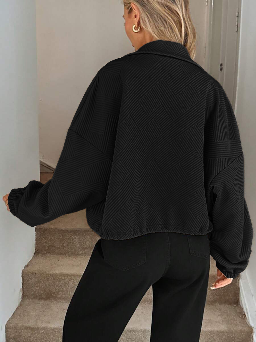 Army green zip-up jacket – front view on model showing textured fabric and ribbed cuffs