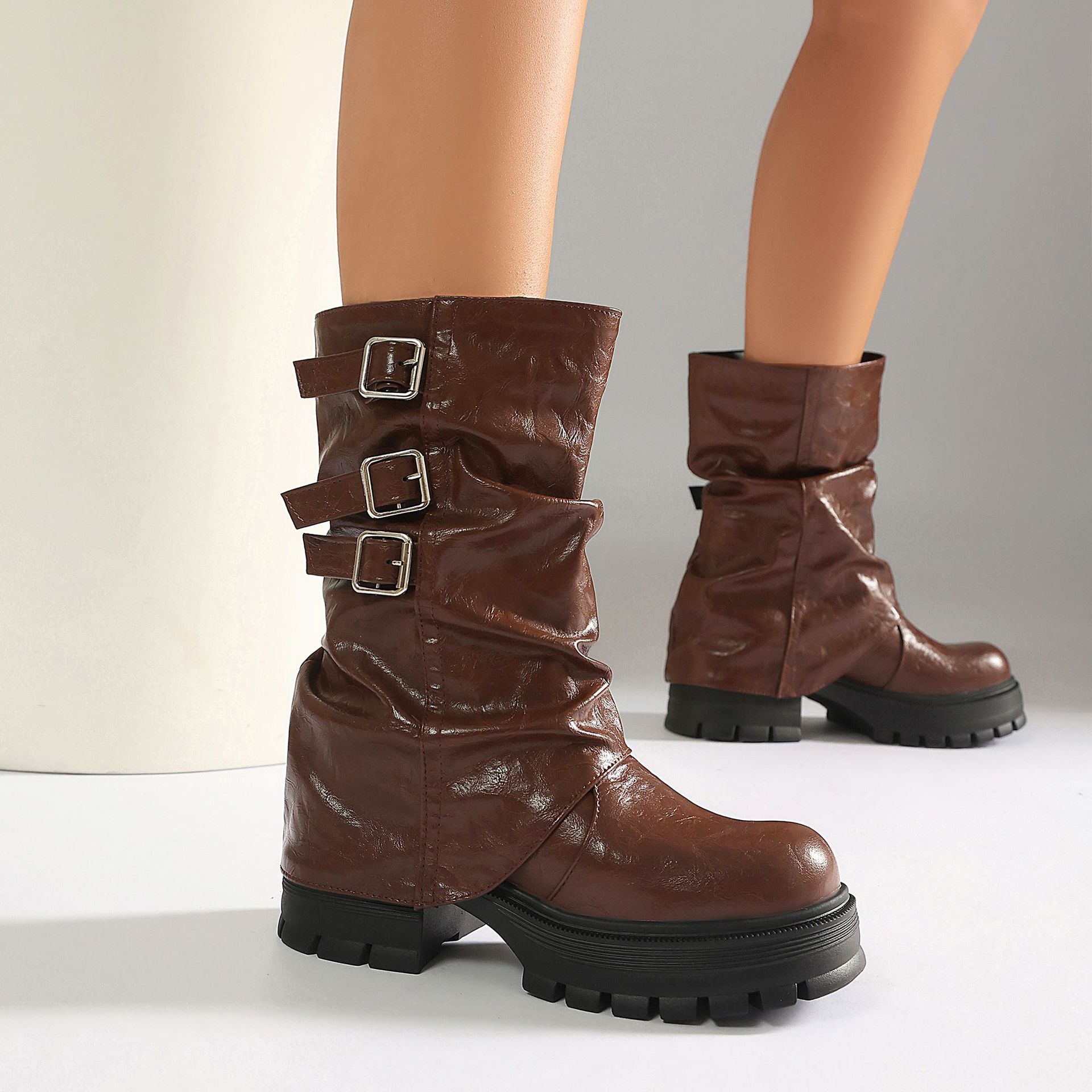 Size reference – women's punk slouchy boots on model showing mid-calf shaft height and fit