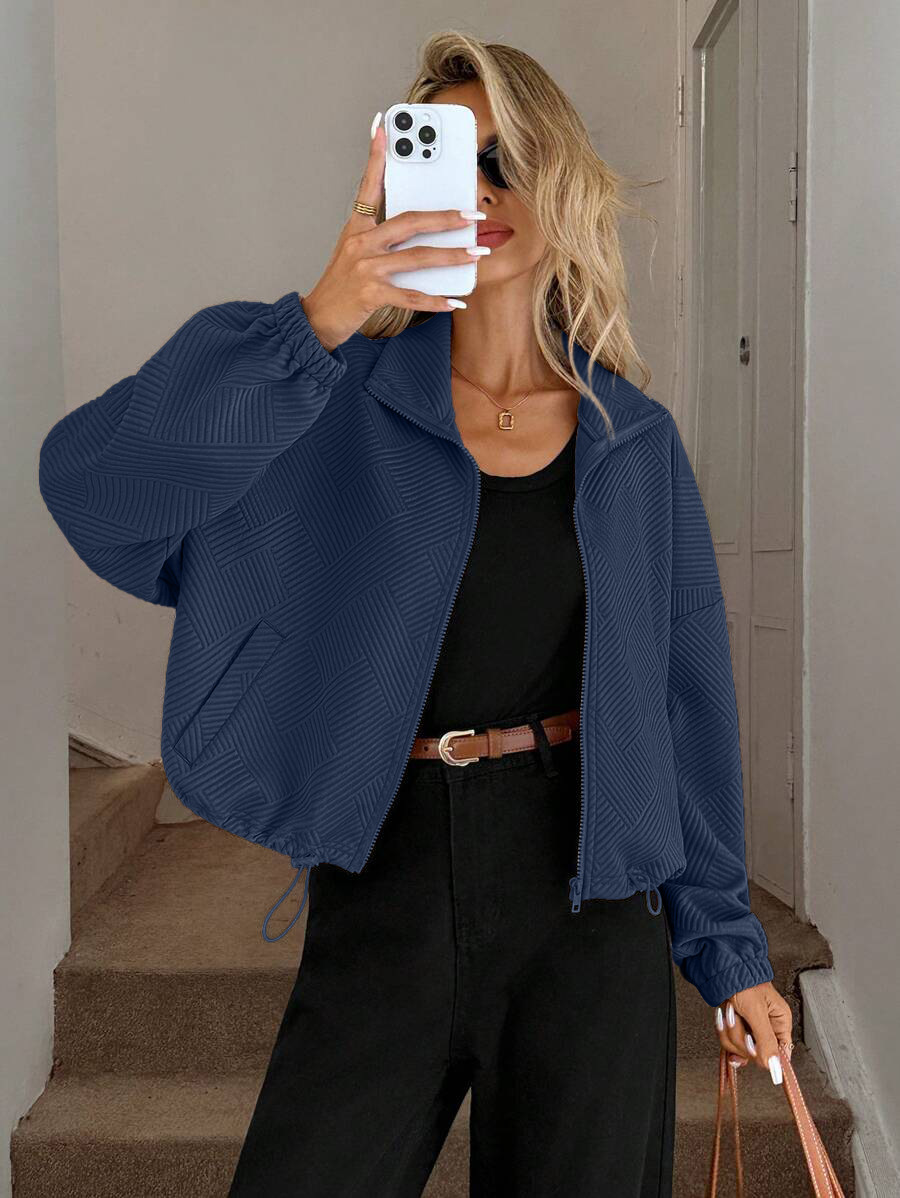 Zip-up jacket – close-up of textured jacquard fabric and ribbed cuff