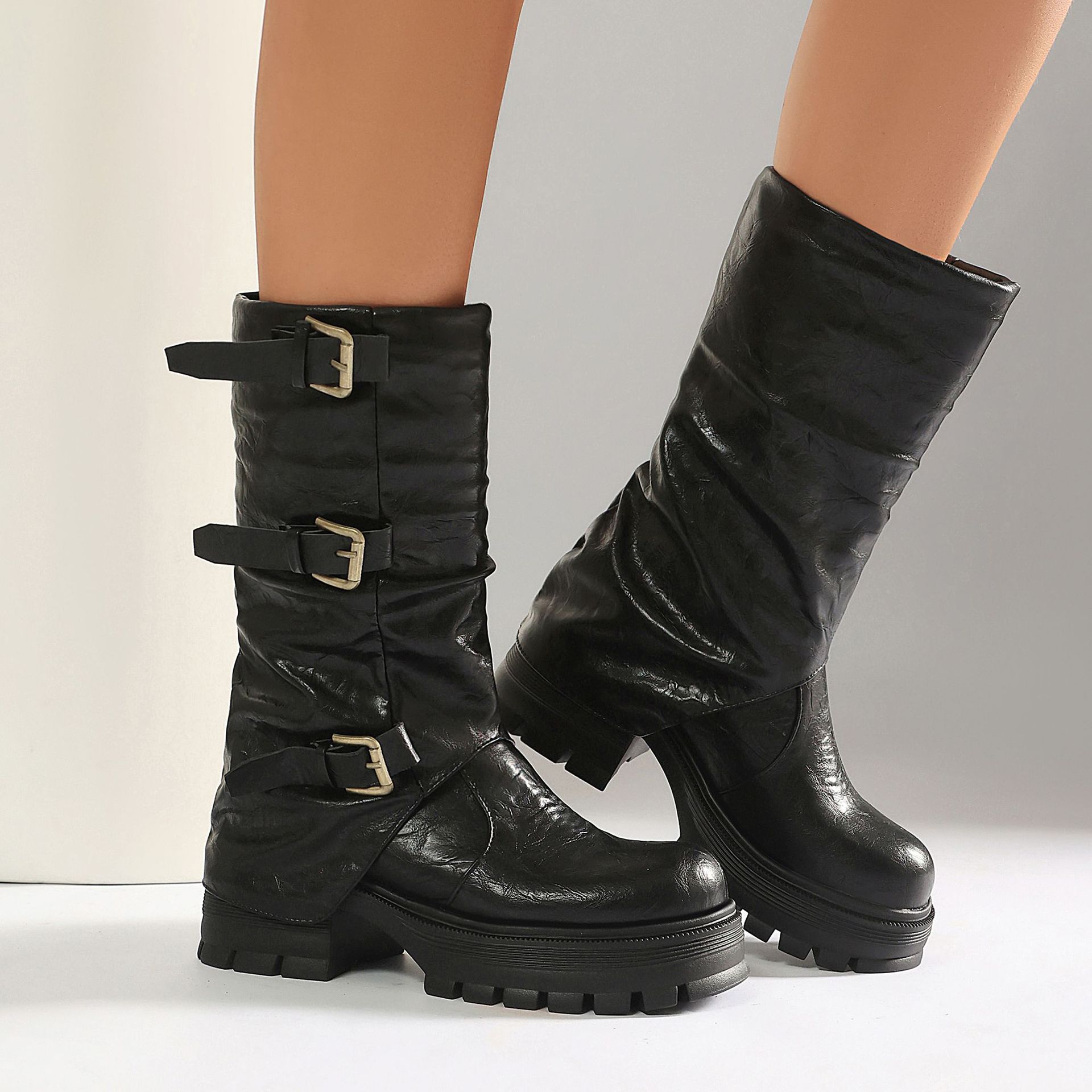 Brown moto boots – side view showing chunky lug sole platform and block heel profile