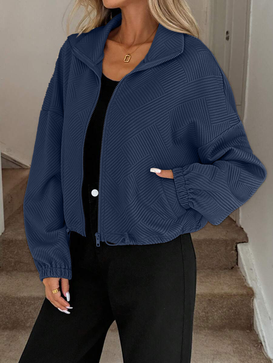 Navy blue zip-up jacket styled with matching trousers – monochrome outfit inspiration