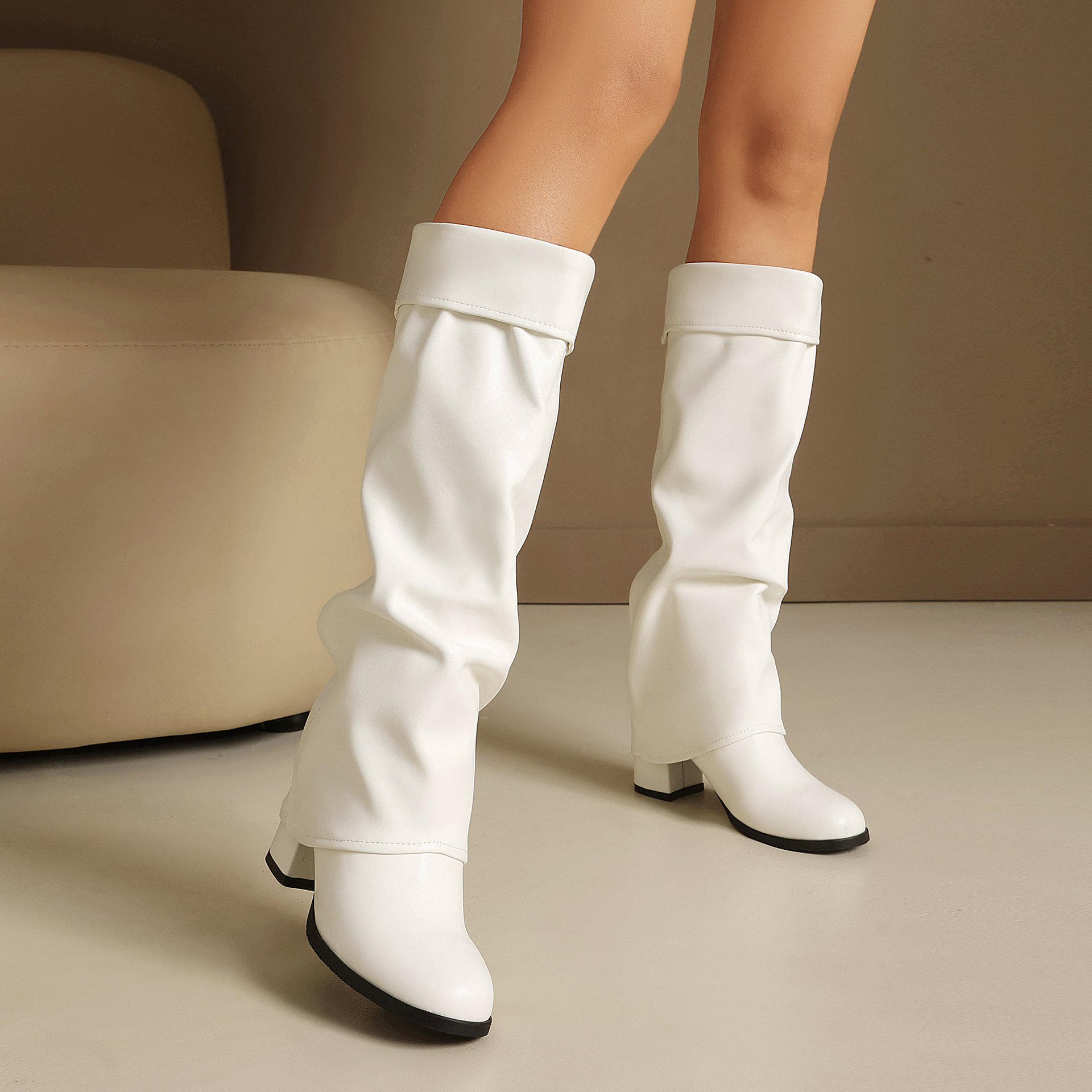 Size reference – women's tall knee-high boots on model showing shaft height and fit