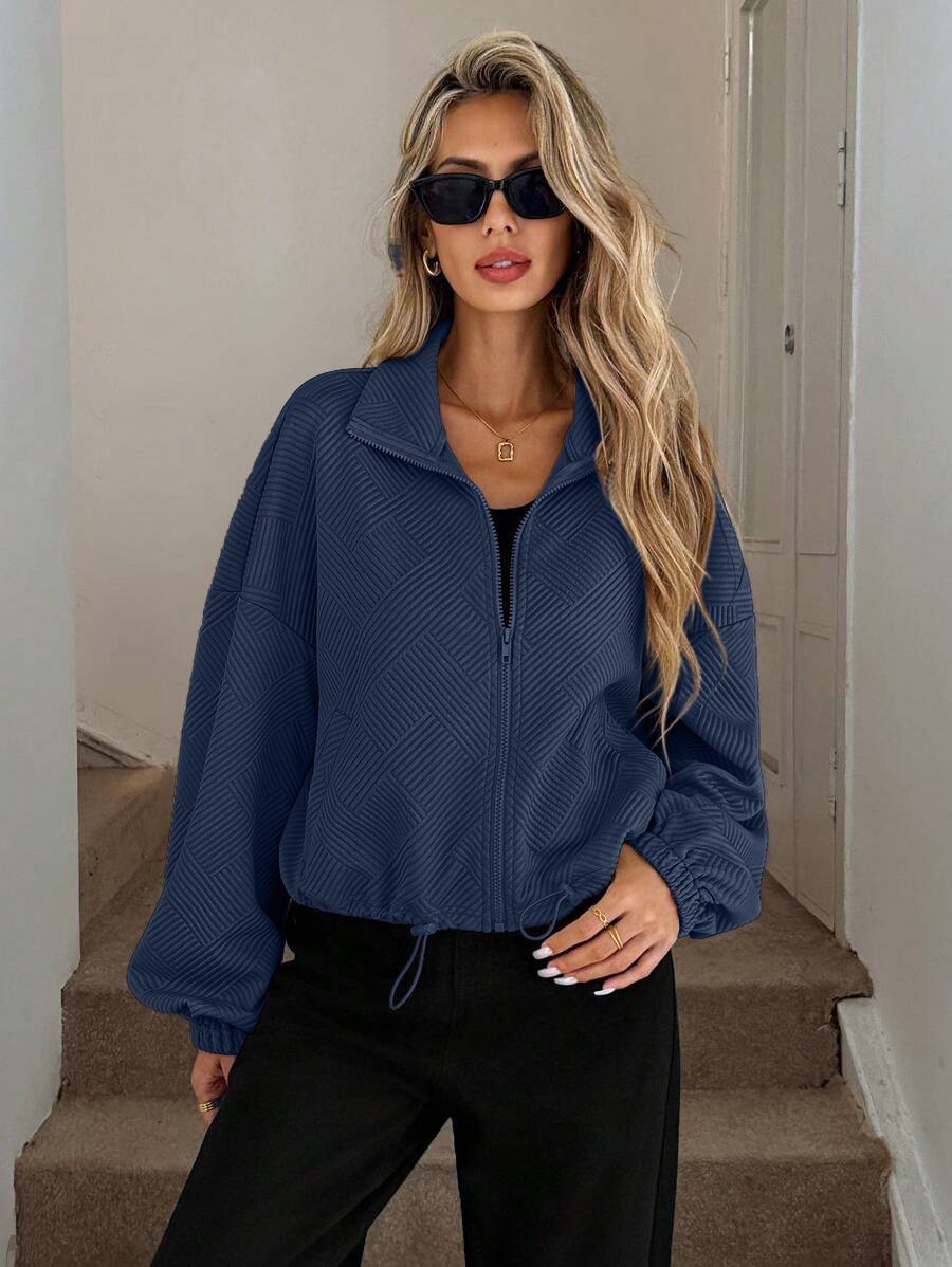Women's oversized zip-up jacket in black – front view on model