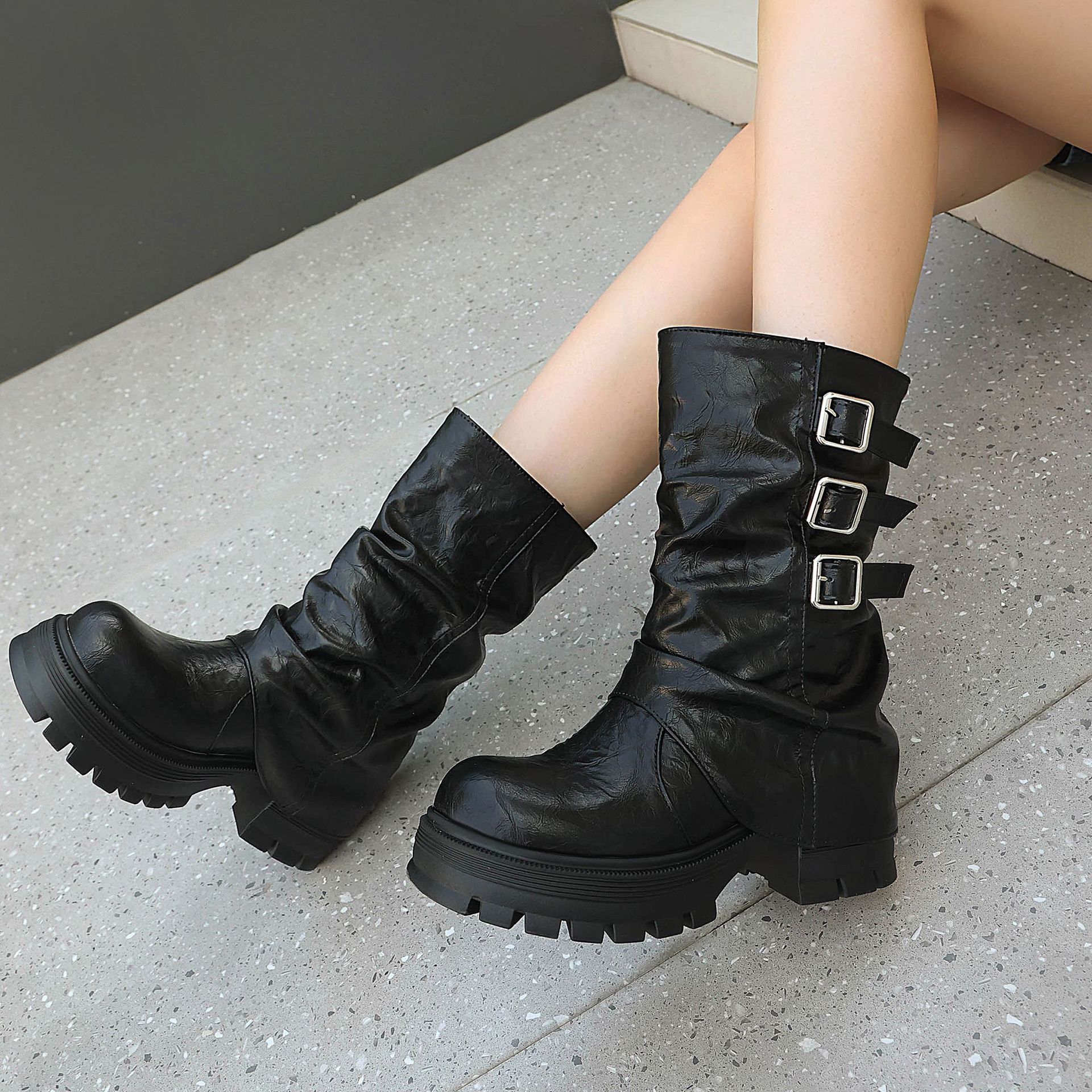 Brown crinkled PU punk boots – close-up of three silver square buckle straps and slouchy shaft drape