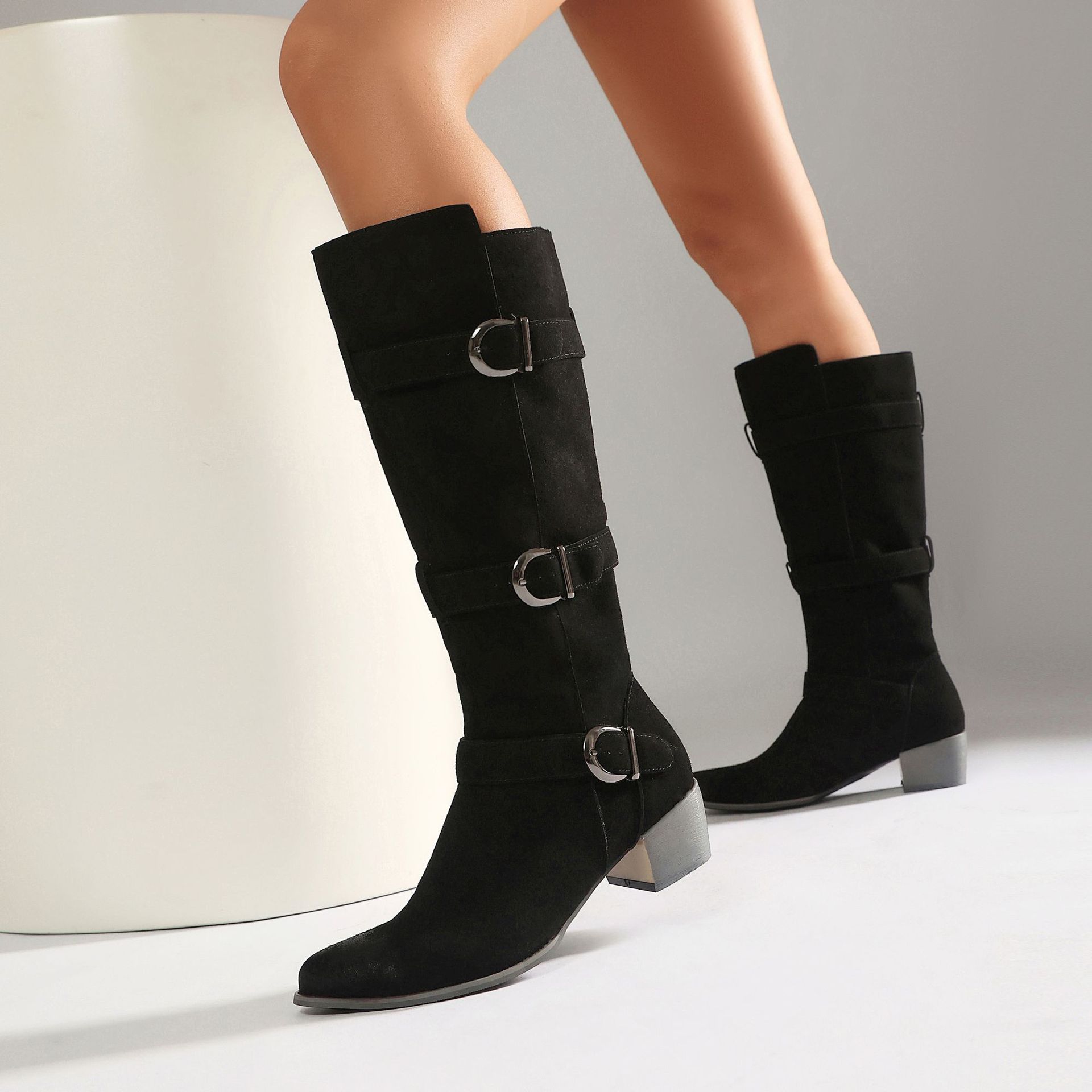 Women's OTK boots worn with jeans – block heel suede boots street style