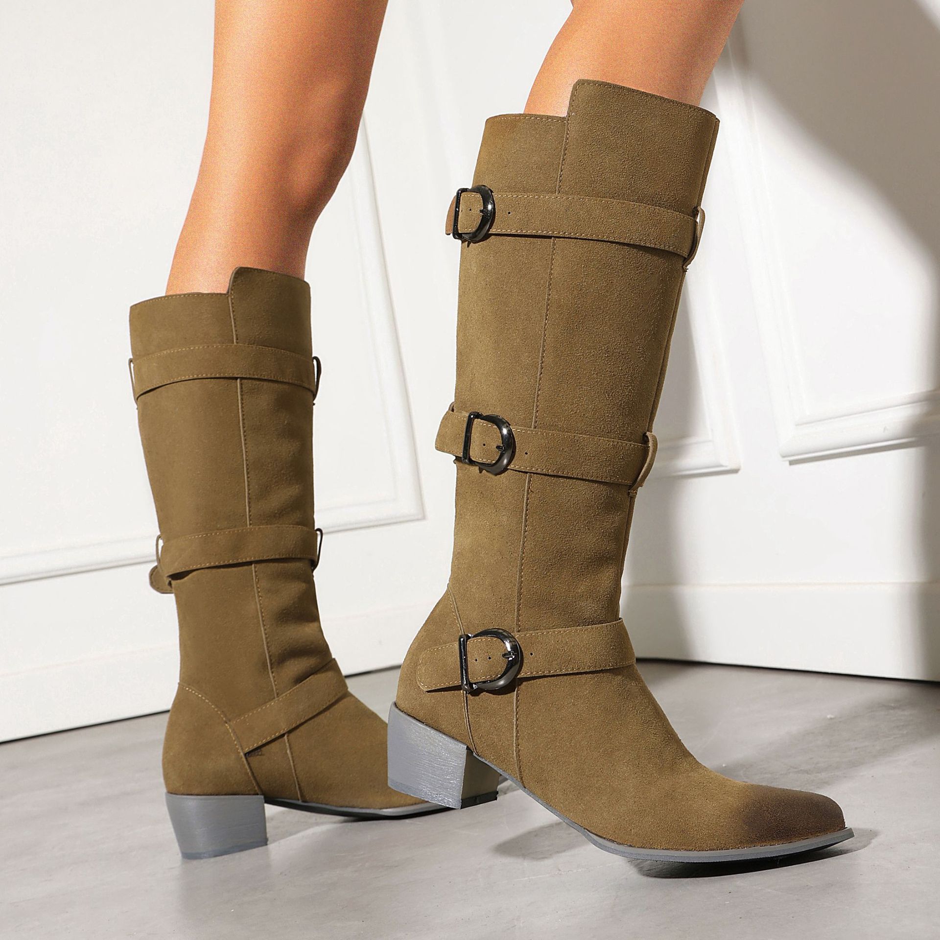 Women's chunky heel suede boots – lifestyle editorial shot