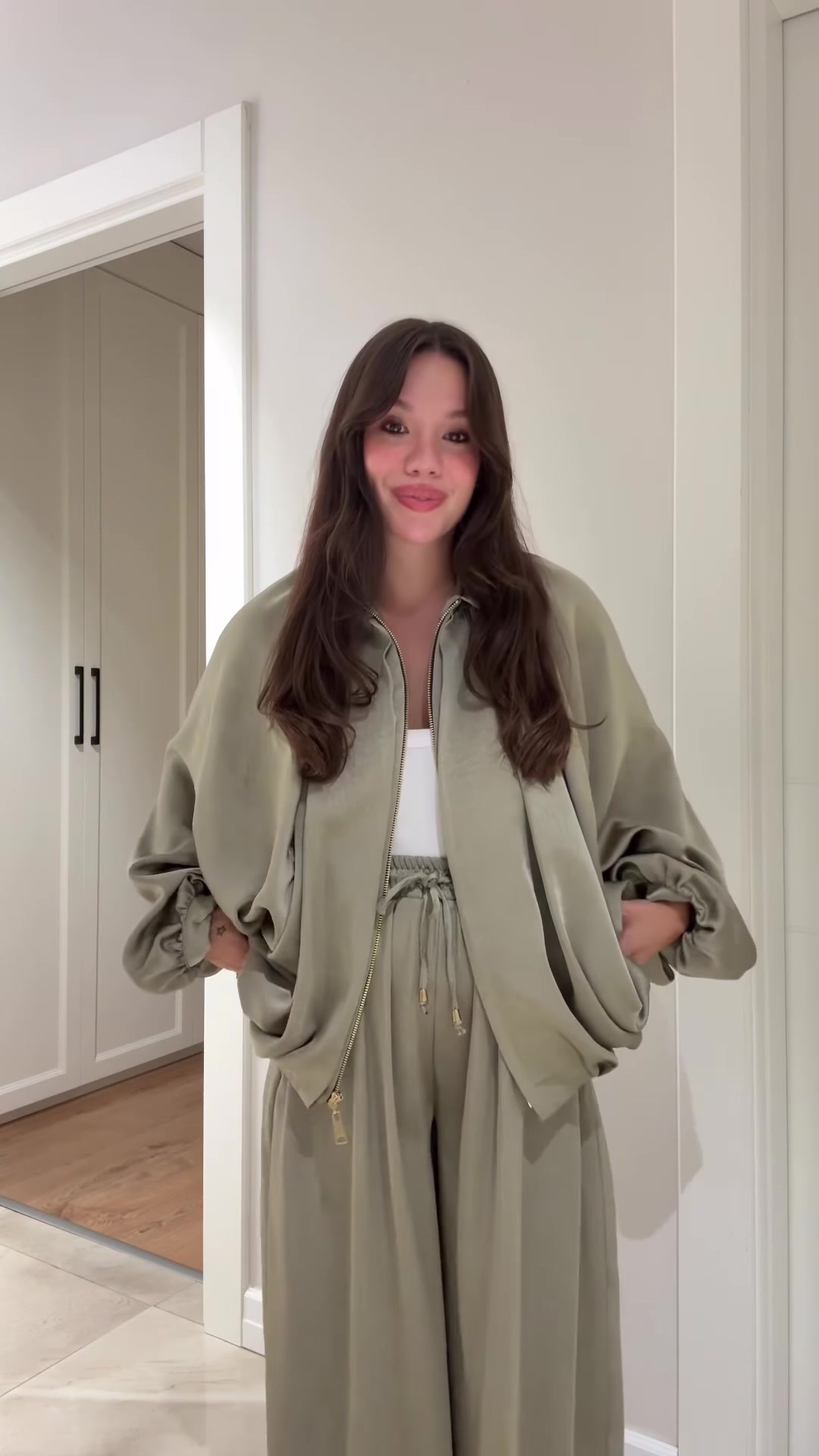 Flip collar jacket and pants set in matcha green – styled casually with sneakers