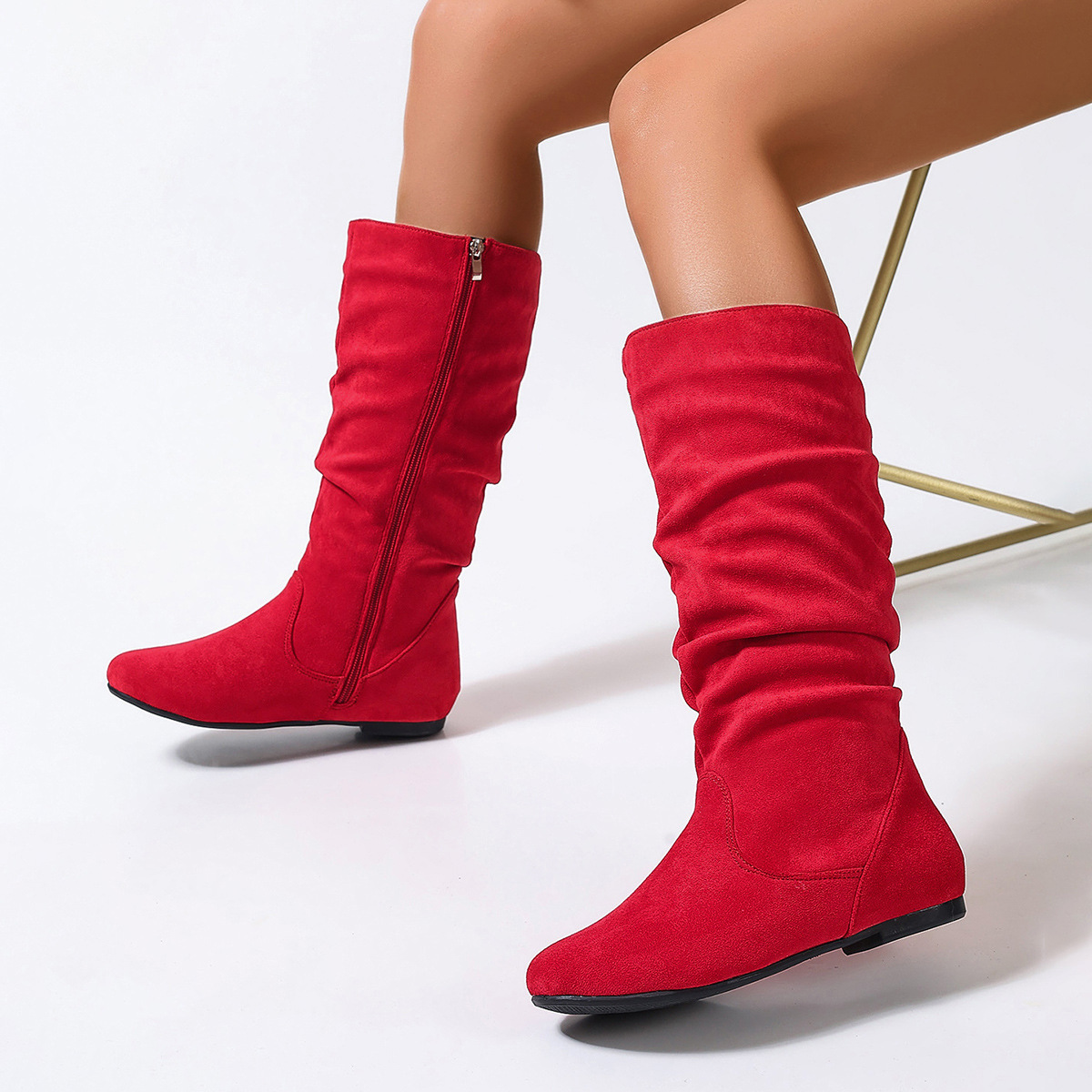 Women's mid-calf boots worn with skirt – styling inspiration