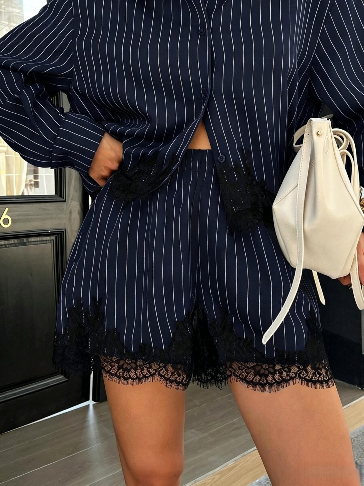 Dark gray striped shirt set – back view on model showing relaxed fit and lace trim hem