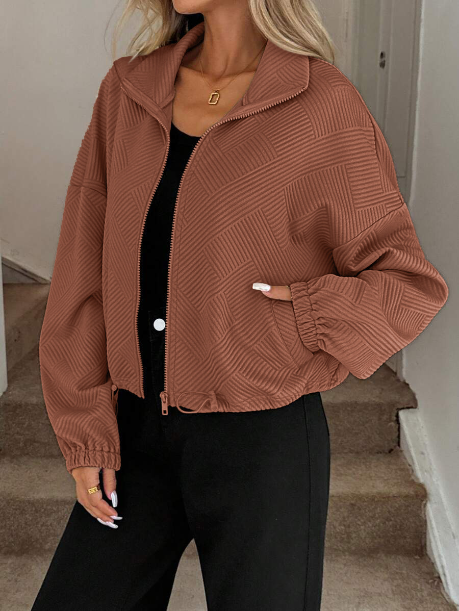 Caramel high neck zip-up jacket – lifestyle shot showing relaxed streetwear styling