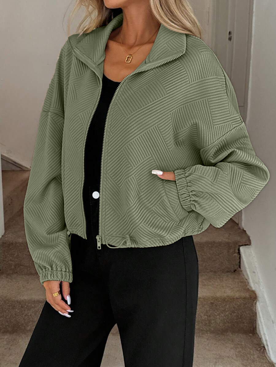 Caramel oversized zip-up jacket – side view showing loose silhouette and pocket detail