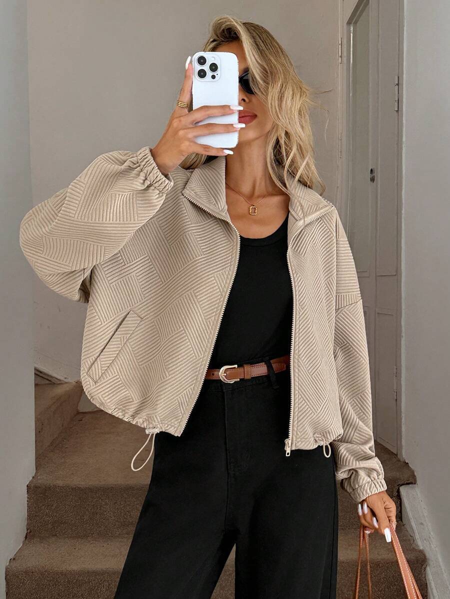 Caramel oversized jacket – back view showing relaxed silhouette and drawstring ribbed hem