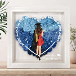 Personalized graduation flower shadow box with woman in cap and gown, blue flowers, and inspirational message
